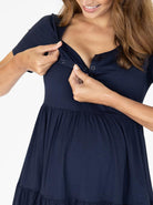 A woman in navy maternity tiered dress, nursing (4827569651806)