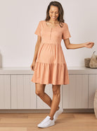 Main view - A pregnant Woman in  Knee Length Orange Maternity Tiered Dress (6714696826983)