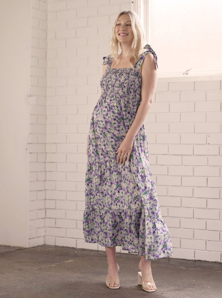Main view - A Pregnant Woman in Purple Floral Maternity Maxi Dress smiling (6726602621022)