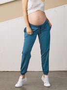 Main View - A Pregnant Woman in Low Waist Blue Maternity Jogger Pants from Angel Maternity  (6720385220711)
