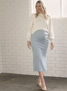 Full fron view - A Pregnant Woman in Skye Blue Fitted Maternity Midi Dress (6726602883166)