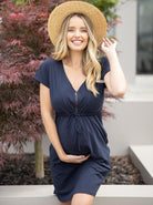 A woman in zipper drawstring navy maternity nursing dress, lifestyle (4801470070878)